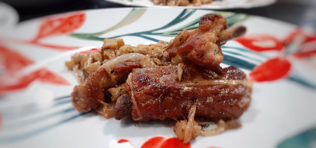Receta de costillar de cerdo con queso y comino